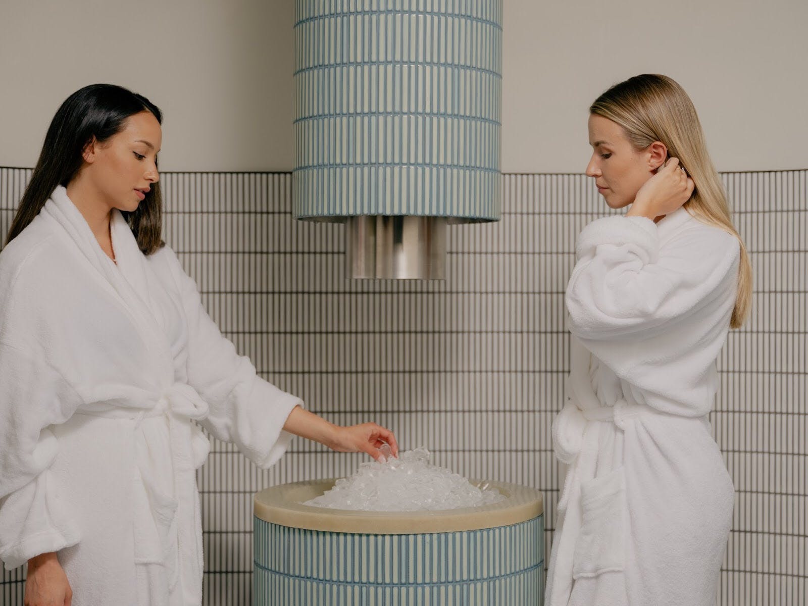 Two ladies standing at the ice fountain