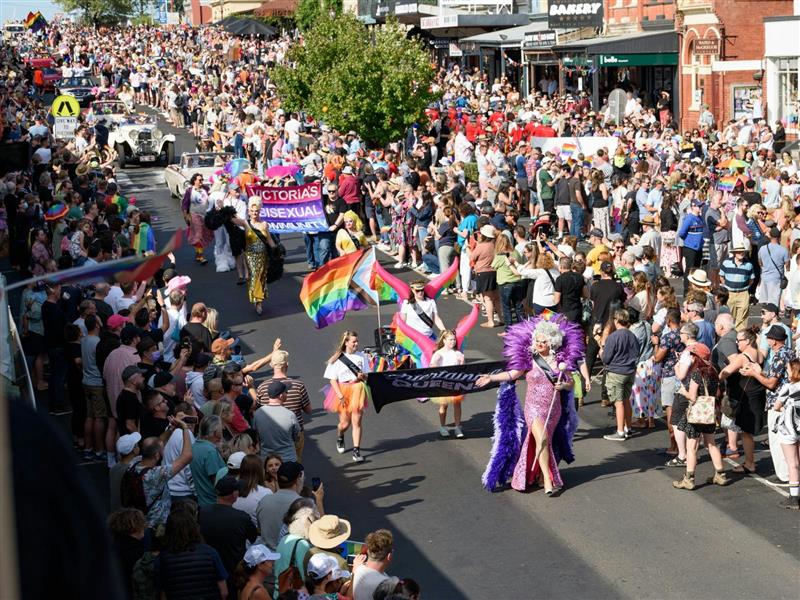 View from second floor window os a colourful parade on the main street of Daylesford