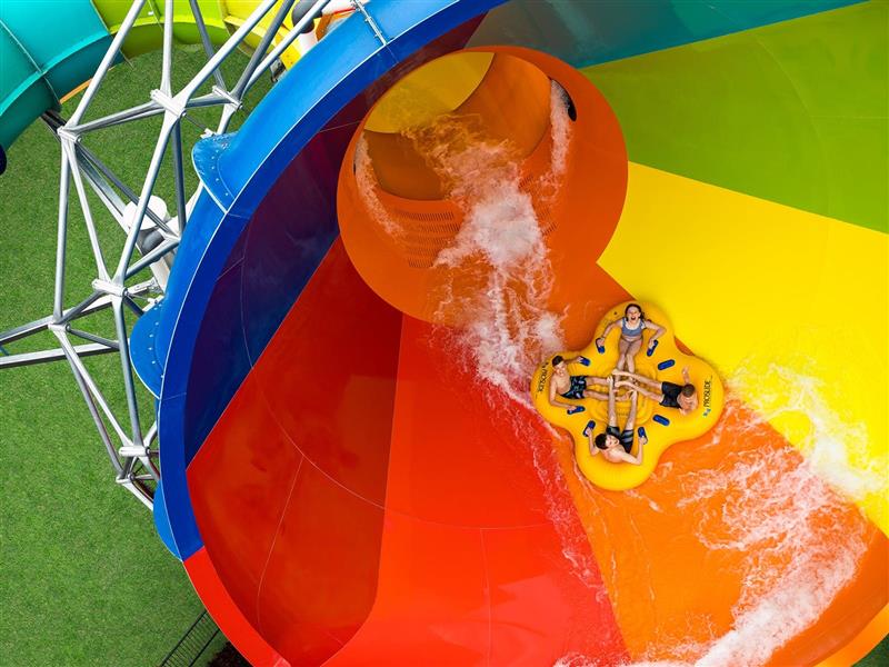 aerial shot of a tube of people going down the Tsunami funnel