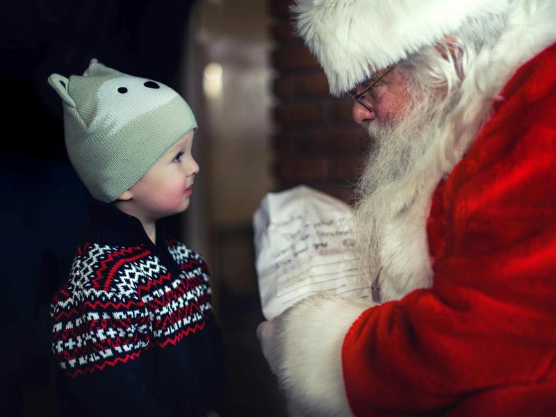 Young boy meeting Santa