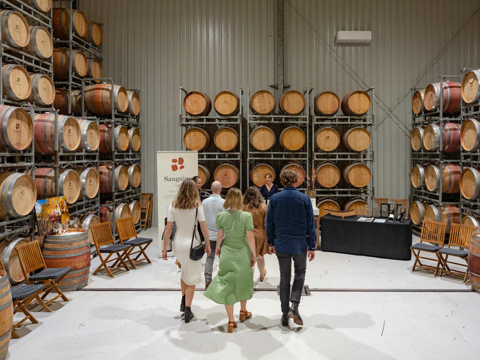 Rambling tour group entering the barrel room to taste some award winning wine